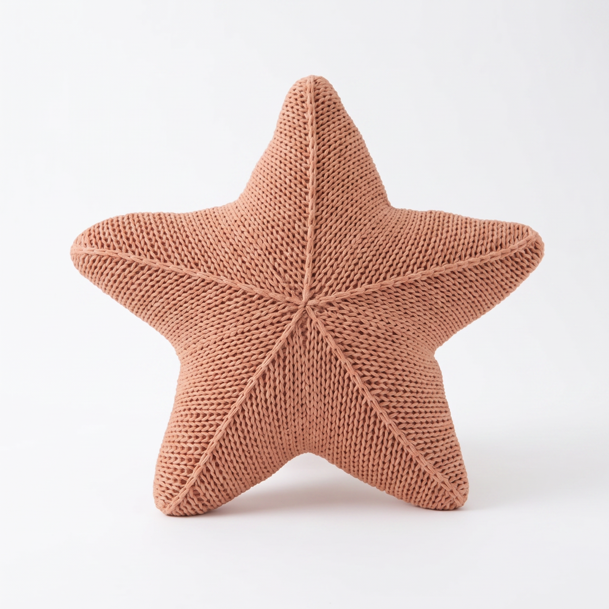 Zoe hand-knitted starfish cushion in Starfish Dream on a white background